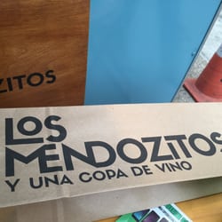 Los Mendozitos - If you insist, you can purchase your bottle to-go.  But stay a while, really, the crowd and concept are fun.