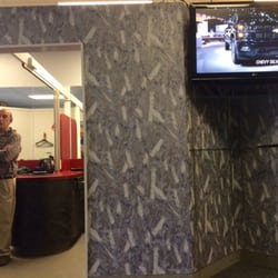 Village Square Men's Styling Salon - Flat screen and a room