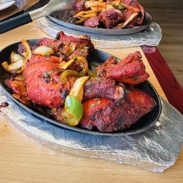 Chicken Tandoori with onions and bell peppers! You can definitely share this meal and still have left overs. Chicken Tandoori with onions and bell peppers! You can definitely share this meal and still have left overs.