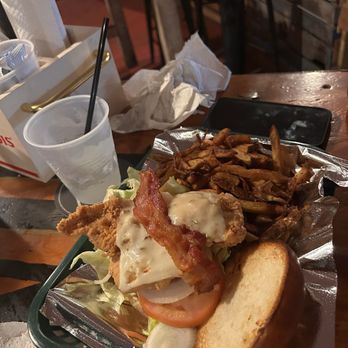 Bernie's - Chicken sandwich came fully loaded with lettuce, tomato, grilled onion, cheese, and bacon. - Music Venues Near Me - Red Hook, Virgin Islands Bernie's - Chicken sandwich came fully loaded with lettuce, tomato, grilled onion, cheese, and bacon. - Music Venues Near Me - Red Hook, Virgin Islands