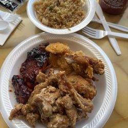 New China Buffet - BBQ chicken, peanut butter chicken fried shrimp and fish with a side of fried rice.