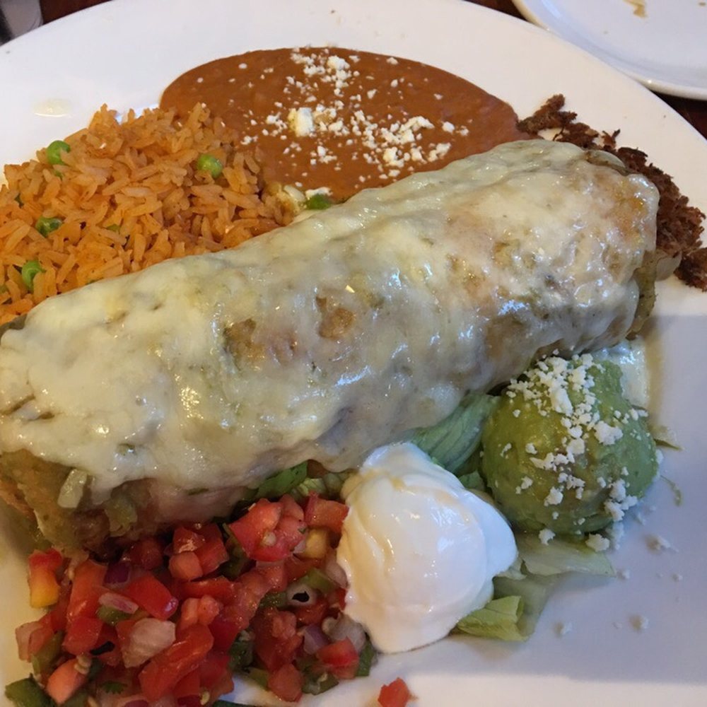 El Charro Cafe - Carne Seca Chimichanga, Elegante style with green sauce. Super flavorful!! - Mexican Near Me - Tucson, Arizona El Charro Cafe - Carne Seca Chimichanga, Elegante style with green sauce. Super flavorful!! - Mexican Near Me - Tucson, Arizona