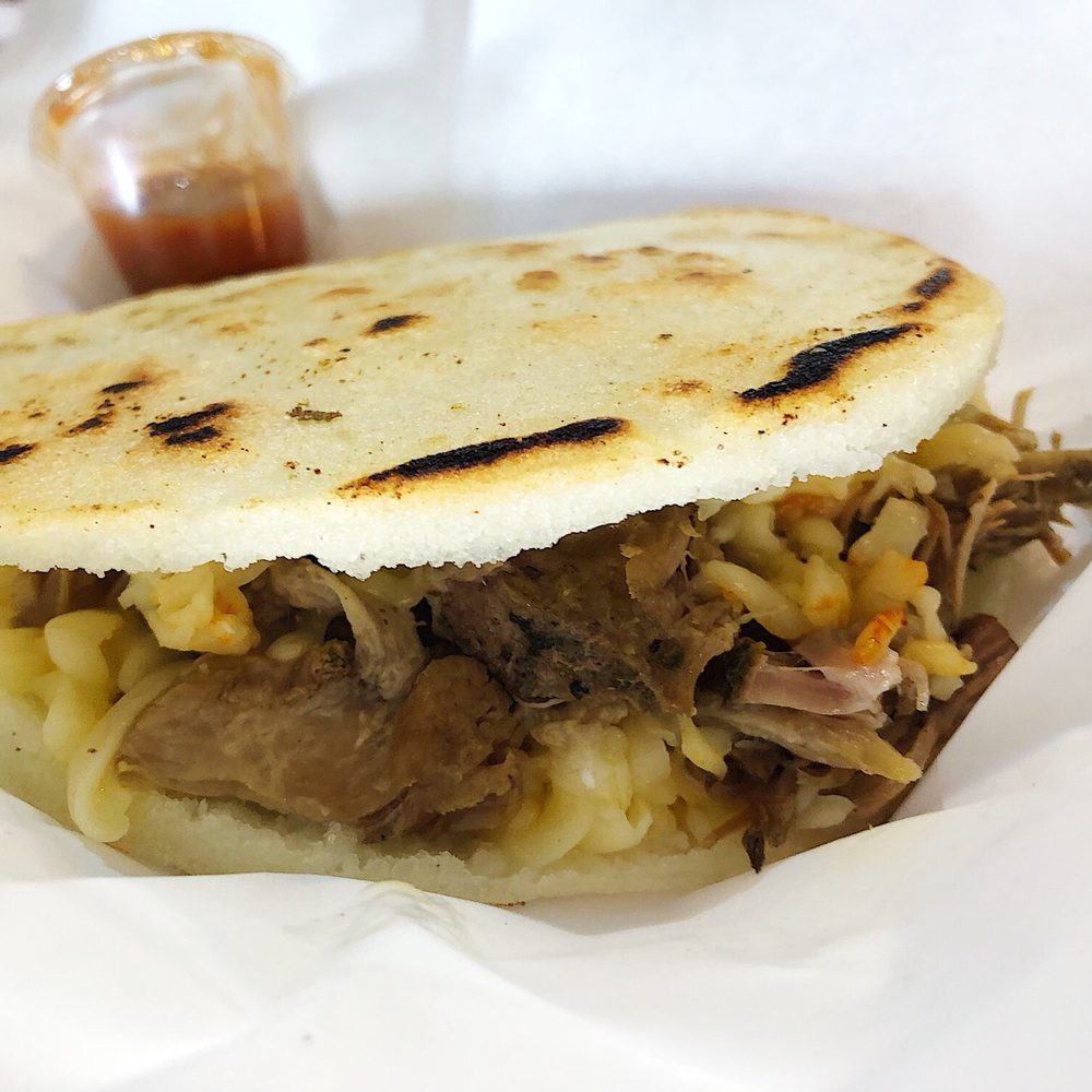The Arepazo Grill - The Piggie (pork + cheee) Arepa with gouda - Venezuelan Near Me - Lakeland, Florida The Arepazo Grill - The Piggie (pork + cheee) Arepa with gouda - Venezuelan Near Me - Lakeland, Florida