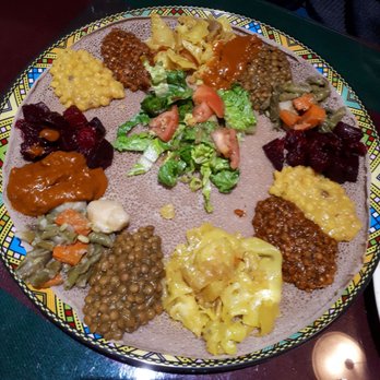 Lalibela Ethiopian Restaurant - Veggie platter (look at all the beautiful sauces on the fluffy injera!) - Ethiopian Near Me - Toronto, Ontario Lalibela Ethiopian Restaurant - Veggie platter (look at all the beautiful sauces on the fluffy injera!) - Ethiopian Near Me - Toronto, Ontario