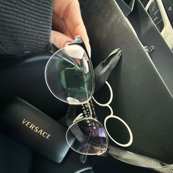 Optiluxe Optometry - Glasses off face plus packaging and official Versace case to go with glasses