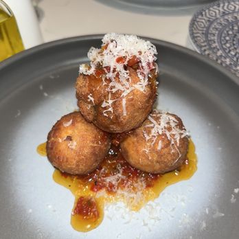 Il Falò - Arancini served with pepper jelly - Italian Near Me - Raleigh, North Carolina Il Falò - Arancini served with pepper jelly - Italian Near Me - Raleigh, North Carolina