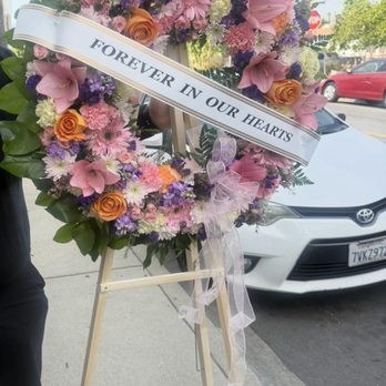 Funeral flowers for less - Pastel color Funeral wreath - Florists Near Me - La Mirada, California