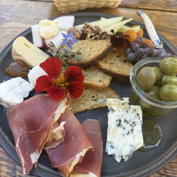 The Lost Kitchen - A charcuterie board I think it goes around the building. I think I can turn around right - Salad Near Me - Freedom, Maine