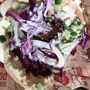 Naf Naf Grill - Messy but, oh, so good pita with falafel, red cabbage, cucumber, tachina, pickles, et al - Middle Eastern Near Me - Chicago, Illinois Naf Naf Grill - Messy but, oh, so good pita with falafel, red cabbage, cucumber, tachina, pickles, et al - Middle Eastern Near Me - Chicago, Illinois