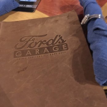 Ford's Garage Dearborn - Cool menus and decor made to look like a "car garage." The family loved the theme and the place had an antique look with a modern twist. - Burgers Near Me - Dearborn, Michigan Ford's Garage Dearborn - Cool menus and decor made to look like a "car garage." The family loved the theme and the place had an antique look with a modern twist. - Burgers Near Me - Dearborn, Michigan