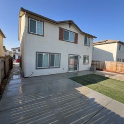 Jimenez Concrete - Broom finish patio w/ sod install and sprinklers