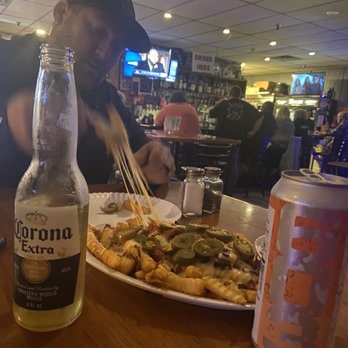 The Bar Food & Spirits - Loaded cheese fries with local 603 and non local Corona! Perfect pairing. Lol - Pubs Near Me - Hudson, New Hampshire The Bar Food & Spirits - Loaded cheese fries with local 603 and non local Corona! Perfect pairing. Lol - Pubs Near Me - Hudson, New Hampshire