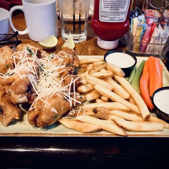 Sierra Gold - Garlic-Parmesan Bon-In Wings with fries and veggie sticks - New American Near Me - Reno, Nevada Sierra Gold - Garlic-Parmesan Bon-In Wings with fries and veggie sticks - New American Near Me - Reno, Nevada