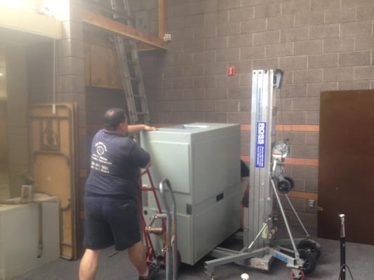 Church A/C - This was a large air handler inside a church that was suspended in the wall. We used a lift to get the air handler into place and replaced the condenser on the roof. Church A/C - This was a large air handler inside a church that was suspended in the wall. We used a lift to get the air handler into place and replaced the condenser on the roof.