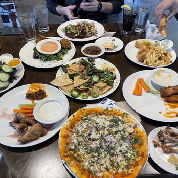 Ogden Beer Company - Nachos in the middle, wings, steak salad and Buffalo chicken pizza - Brewpubs Near Me - Ogden, Utah Ogden Beer Company - Nachos in the middle, wings, steak salad and Buffalo chicken pizza - Brewpubs Near Me - Ogden, Utah