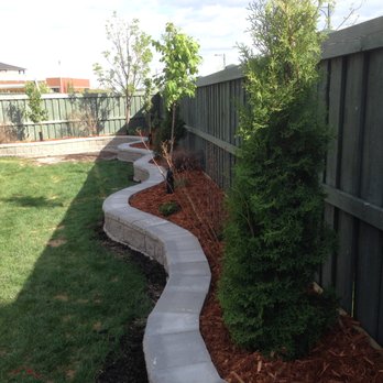 Green Stake Contracting - a curved walkway in a backyard - Landscaping Near Me Green Stake Contracting - a curved walkway in a backyard - Landscaping Near Me