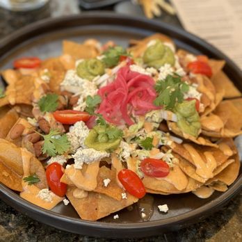 The Plot - Pinto beans and guacamole nachos - Vegan Near Me - Costa Mesa, California The Plot - Pinto beans and guacamole nachos - Vegan Near Me - Costa Mesa, California