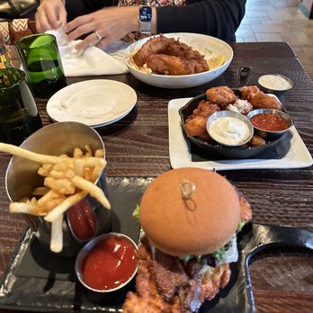 Louie's Wine Dive - Fried Champagne Fish and Chips Dinner and Honey Butter Chicken Sandwich and fried Squeaky Cheese - New American Near Me - Des Moines, Iowa