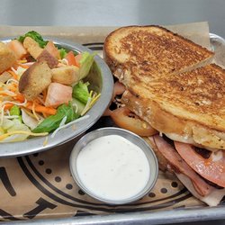 Chubby's Public House - Grilled club sandwich with a side house salad.