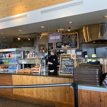 Buffalo's - a man standing at a counter in a restaurant - New American Near Me - Vail, Colorado