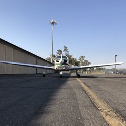 Nut Tree Airport - Piper Warrior in front of hangars