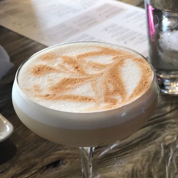 Bosscat Kitchen & Libations - Whiskey sour topped with egg white - New American Near Me - Irvine, California Bosscat Kitchen & Libations - Whiskey sour topped with egg white - New American Near Me - Irvine, California