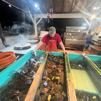 Union River Lobster Pot - The lobster chef boiling lobsters outside the restaurant. - Seafood Near Me - Ellsworth, Maine Union River Lobster Pot - The lobster chef boiling lobsters outside the restaurant. - Seafood Near Me - Ellsworth, Maine