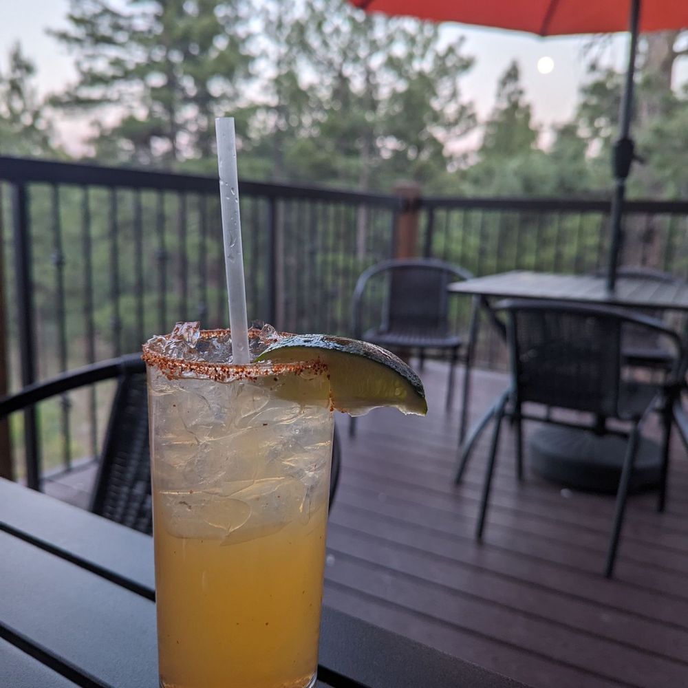 a drink on a patio table a drink on a patio table