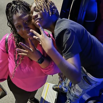 Empowered Charters - Me and my son Christian Isaiah taking a picture from the party bus as he leaves Top Golf the location of his 15th Birthday Party. - Party Bus Rentals Near Me - Valencia, California