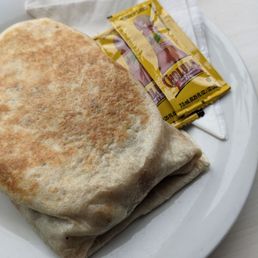 Vegan breakfast burrito with cute little Cholula packets Vegan breakfast burrito with cute little Cholula packets