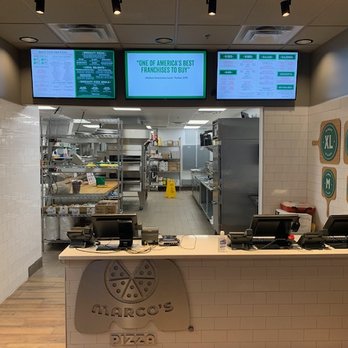 Marco's Pizza - a restaurant counter with menus - Pizza Near Me - Cincinnati, Ohio Marco's Pizza - a restaurant counter with menus - Pizza Near Me - Cincinnati, Ohio