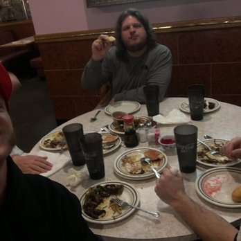 China Bistro - three men sitting at a table with plates of food - Chinese Near Me - Billings, Montana