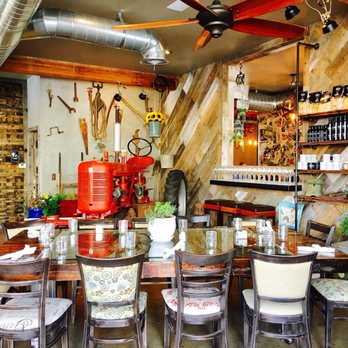 Farmer's Table - Dining area with red tractor Farm ambience - New American Near Me - La Mesa, California