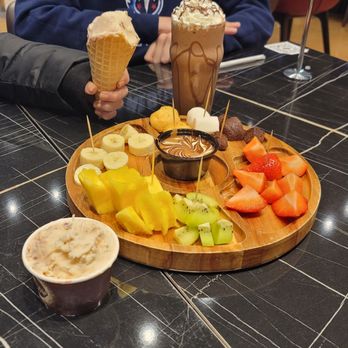 Melt N Dip - Pictured: My passion tray fruit tray (small) Nutella milkshake Gelato in a waffle cone Gelato in a dish - Creperies Near Me - Greenfield, Wisconsin Melt N Dip - Pictured: My passion tray fruit tray (small) Nutella milkshake Gelato in a waffle cone Gelato in a dish - Creperies Near Me - Greenfield, Wisconsin