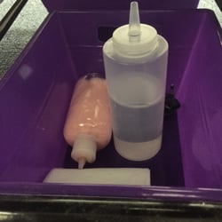 Green Life Spa - Pink lotion and baby oil used for massage (Note: both bottles had hair on them)