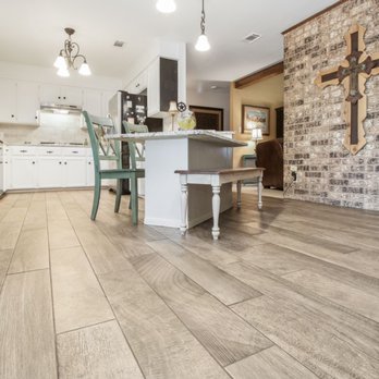 Floor Pros - a brick wall in a kitchen - Flooring Near Me Floor Pros - a brick wall in a kitchen - Flooring Near Me