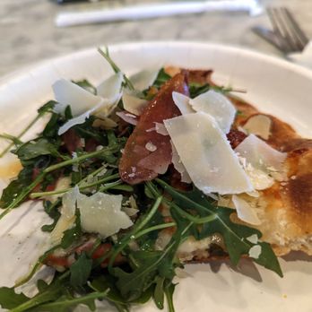 Carluccio's Coal Fired Pizza - Slice of di Parma pizza from a neighboring diner at the counter - Pizza Near Me - Northfield, New Jersey Carluccio's Coal Fired Pizza - Slice of di Parma pizza from a neighboring diner at the counter - Pizza Near Me - Northfield, New Jersey