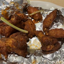 Wings that had a tablespoon of buffalo sauce ladled on them.