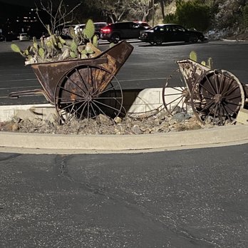 Orange County Mining Company - Old wagon wheels and ore cars. - Steakhouses Near Me - Orange, California