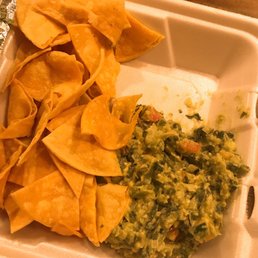 Fresh chips and guacamole with jalapeño