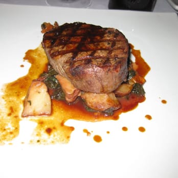 Chandler's - Filet on a bed of greens and roasted potatoes - New American Near Me - Petoskey, Michigan