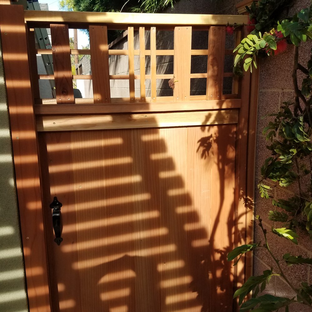 Smith Steven Construction - a wooden gate with lattices - General Contractors Near Me Smith Steven Construction - a wooden gate with lattices - General Contractors Near Me