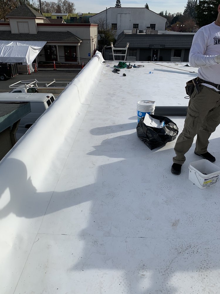 Slide of Flat Roofing Pros
