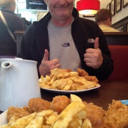 Carlo's Fish And Chips - Awesome fish bites, chips and a cuppa. Happy boy!