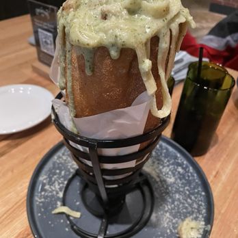 The Operators Club - Pasta with mixed pesto and cream sauce. Served in a loaf of bread. - Sports Bars Near Me - Dallas, Texas The Operators Club - Pasta with mixed pesto and cream sauce. Served in a loaf of bread. - Sports Bars Near Me - Dallas, Texas