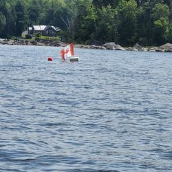 Rideout's Lakeside Lodge & Cottages - Canadian border marker / flag.