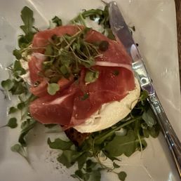 Burrata with prosciutto, arugula, cherry preserves on hearty grainy toast. Ask for a steak knife bit its delicious. Burrata with prosciutto, arugula, cherry preserves on hearty grainy toast. Ask for a steak knife bit its delicious.