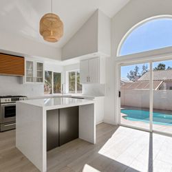 Luxury Homes of Las Vegas - Remodeled kitchen with an abundance of natural light. Thinking about buying or selling a home? contact us today 702-216-4663.