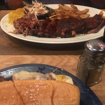 Dinosaur Bar-B-Que - Ribs, pulled pork and brisket in background.  Pulled pork Cuban in foreground.  :) - Barbeque Near Me - Syracuse, New York