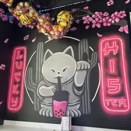 Wall artwork - lucky cat drinking boba and cacti in the background Wall artwork - lucky cat drinking boba and cacti in the background